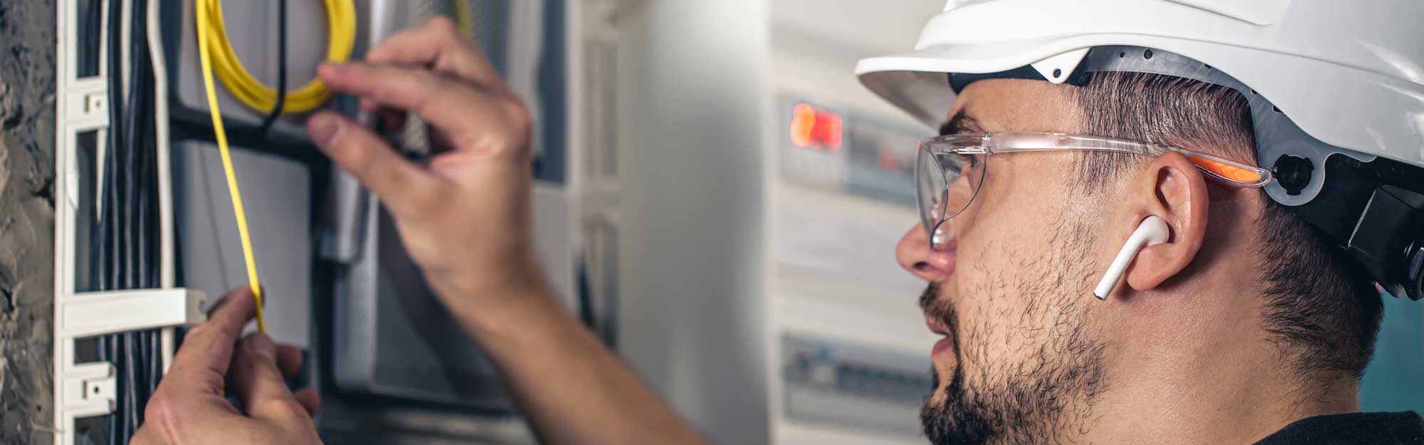 Electrician inspecting residential wiring